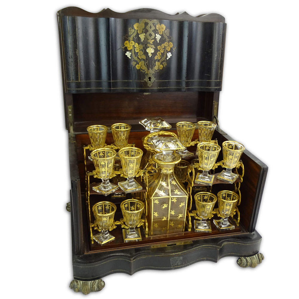 Antique Tantalus Liquor Cabinet. Lacquered wood cabinet with inlaid motif on metal scroll feet.