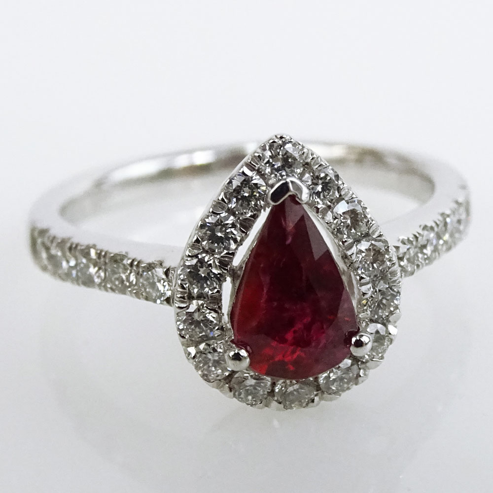 Extremely Rare GIA and AIG Certified 1.02 Carat Natural Unheated Pear Shape Ruby, .54 Carat Round Brilliant Cut Diamond and Platinum Ring. 