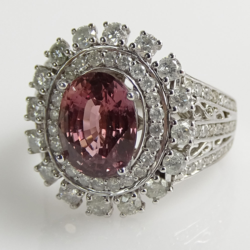 Rare GIA and AIG Certified Natural Unheated 3.44 Carat Oval Step Cut Pink Sapphire, 1.31 carat Round Brilliant Cut Diamond and 14 Karat White Gold Ring. 