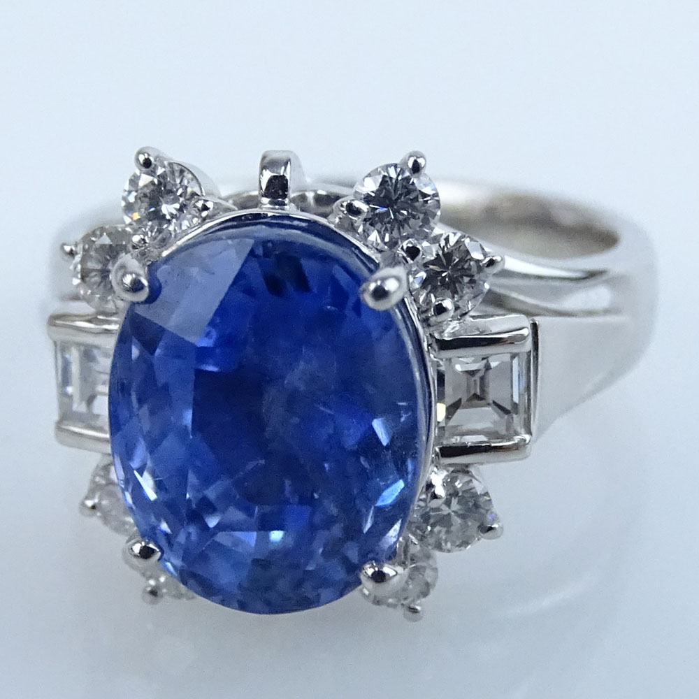 Extremely Rare GIA and AIG Certified 6.04 Carat Oval Cut Natural Unheated Sapphire, .66 Carat Square and Round Brilliant Cut Diamond and Platinum Ring.
