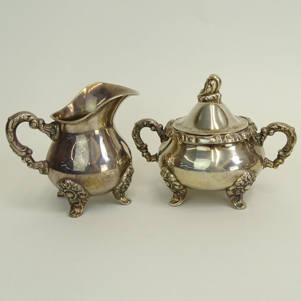 Four (4) Piece Sterling Silver Tea Set on Silver Plate Tray. Includes coffee pot, tea pot, creamer and sugar bowl. 