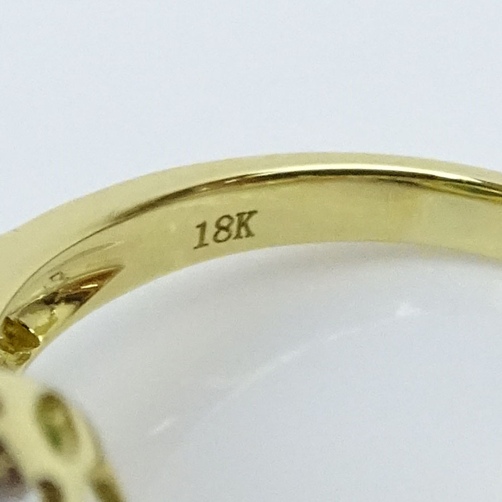 1.37 Carat Pear Shape Emerald, .80 Carat Round Brilliant Cut Diamond and 18 Karat Yellow Gold Ring