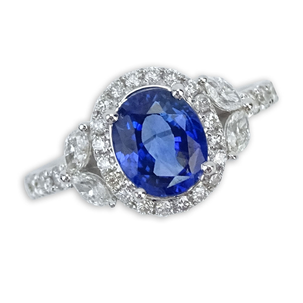 1.99 Carat Oval Cut Sapphire, .64 Carat Diamond and 18 Karat White Gold Ring