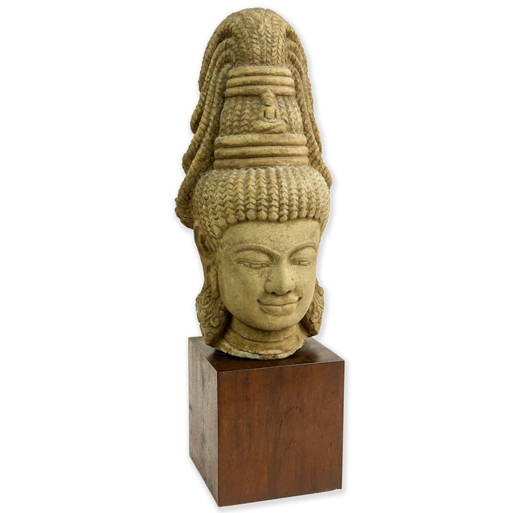 Vintage Cambodian Carved Stone Buddha Head. On wood block.