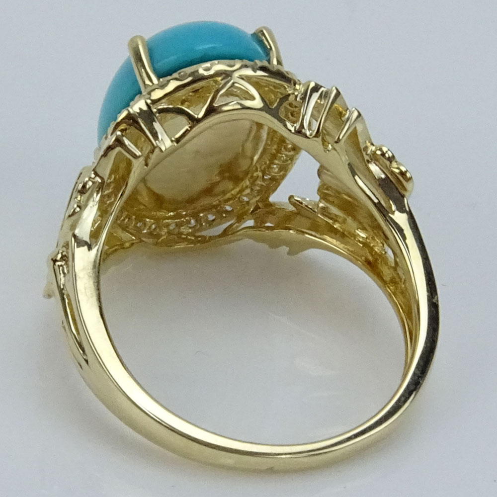 Approx. 4.40 Carat Turquoise and 14 Karat Yellow Gold Ring accented with Small Round Cut Diamonds