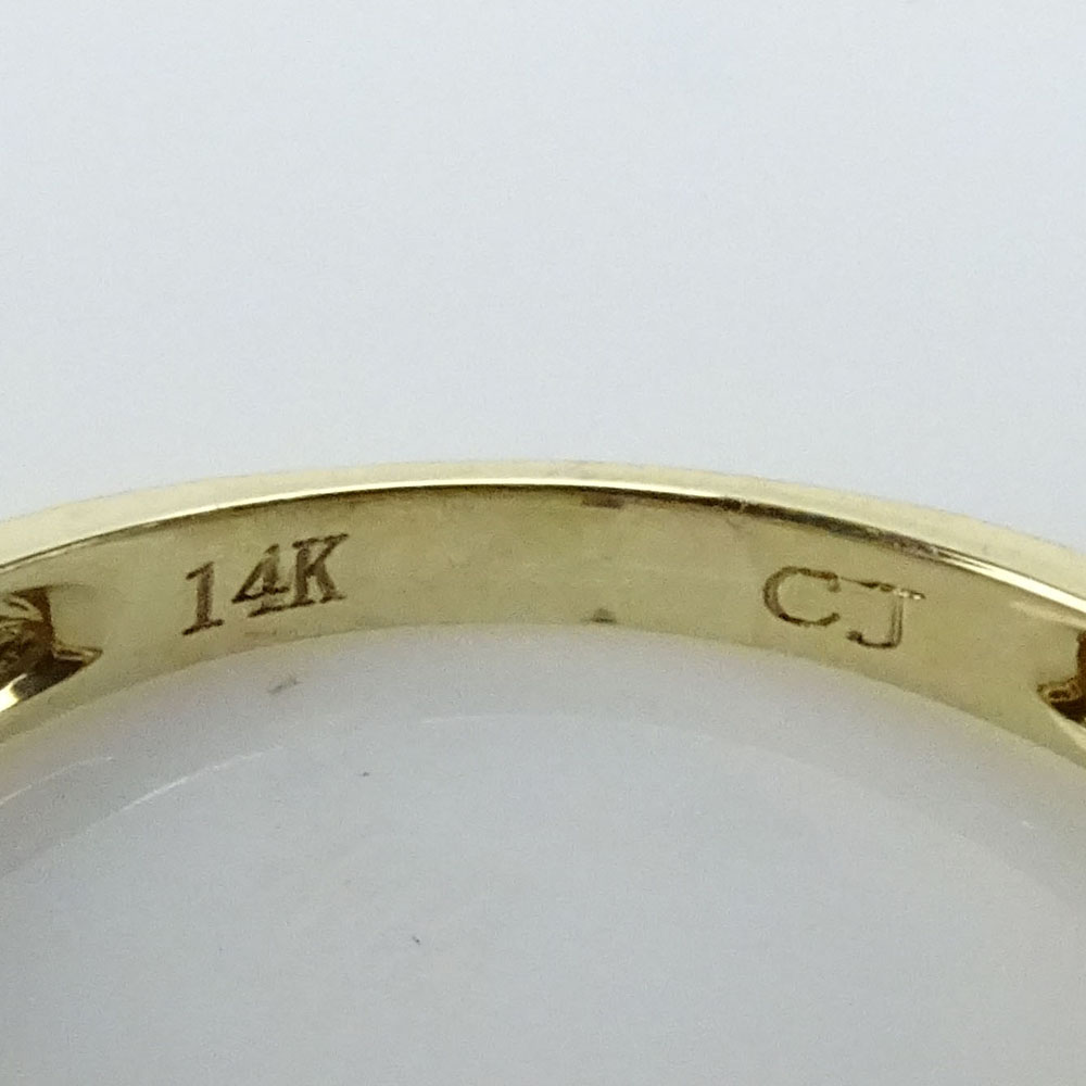 Approx. 1.37 Carat Fire Opal, .75 Carat Round Cut Diamond and 14 Karat Yellow Gold Three Stone Ring