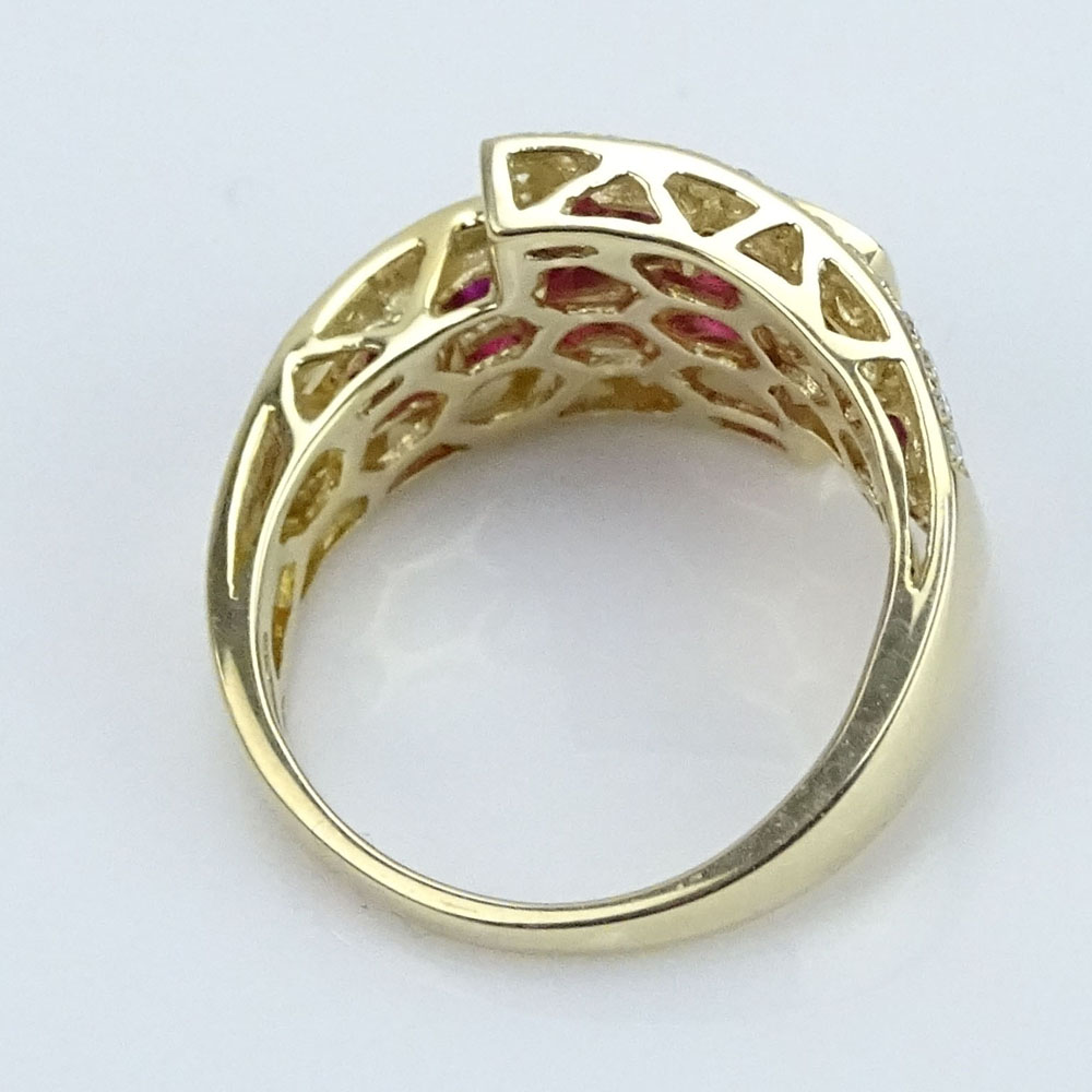 Approx. 2.0 Carat Invisible Set Ruby and 14 Karat Yellow Gold Cross Over Ring