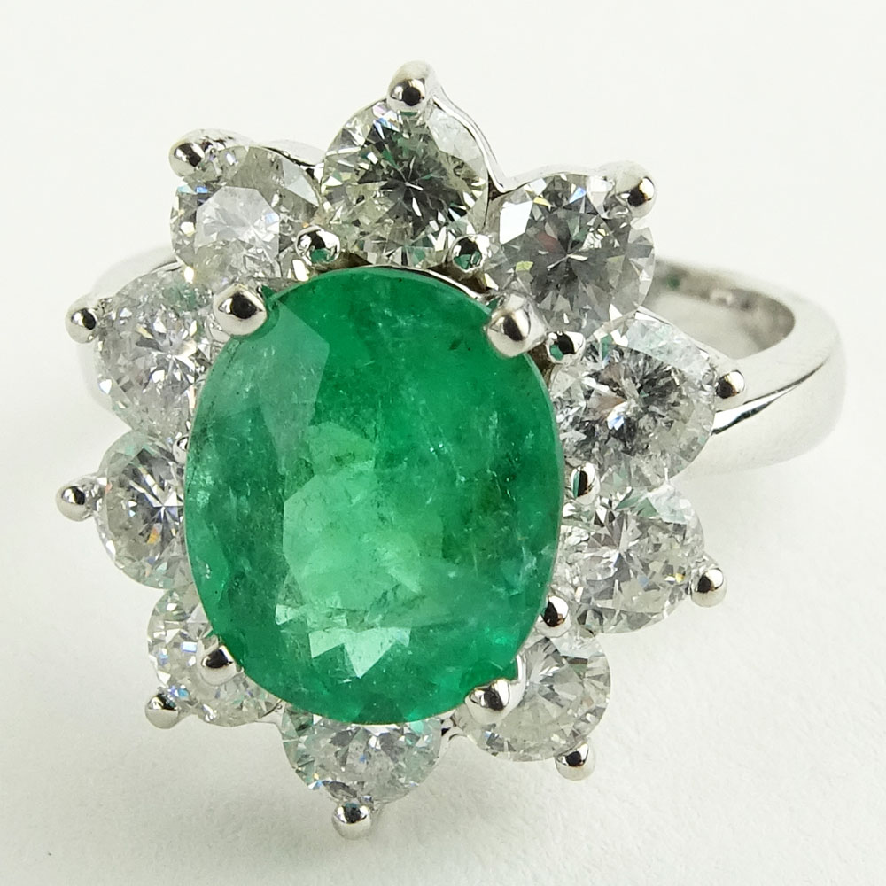 Lady's 2.40 Carat Oval Cut Emerald, 2.15 Carat Round Cut Diamond and 14 Karat White Gold Ring
