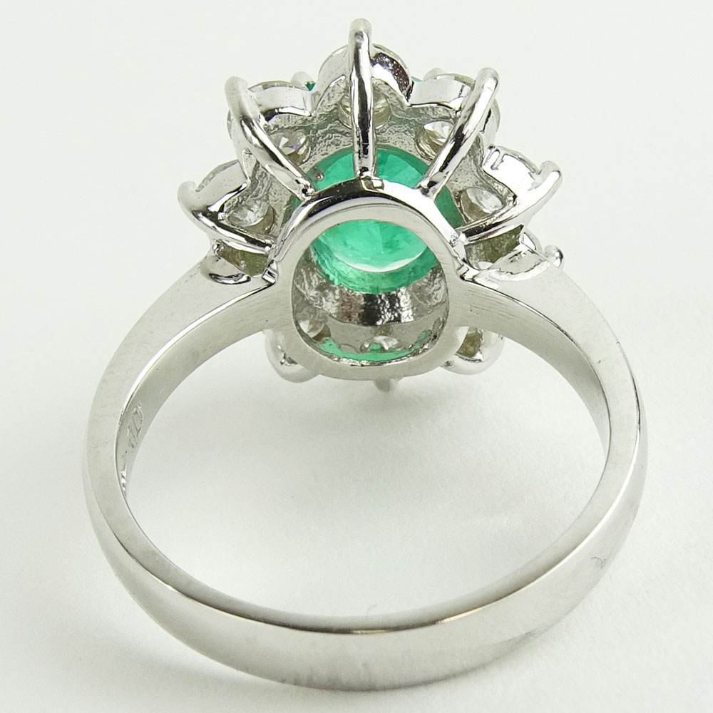 Lady's 2.40 Carat Oval Cut Emerald, 2.15 Carat Round Cut Diamond and 14 Karat White Gold Ring