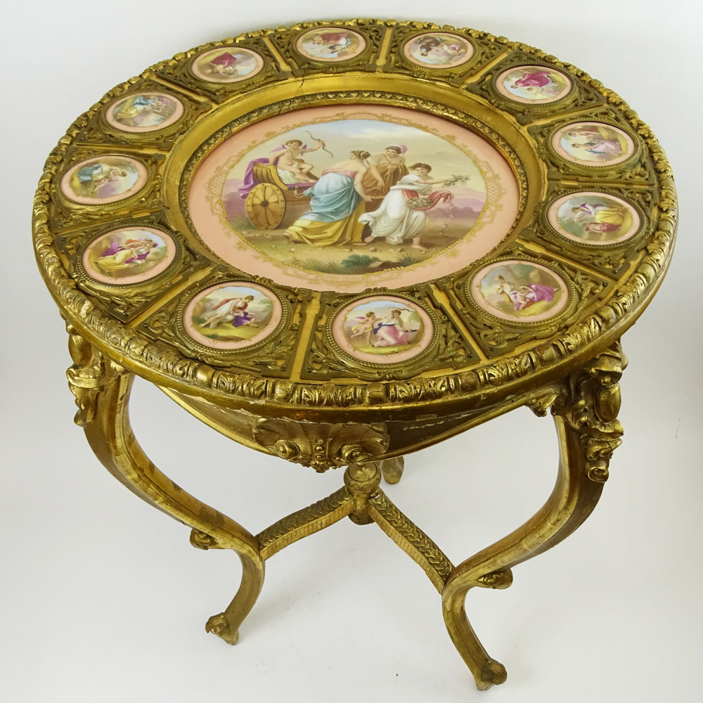 19th Century French Bronze Mounted Giltwood Table With 12 inset Sevres Porcelain Portrait Plaques Depicting Mythological Scenes. Central Plaque Titled "Amors Trumph"