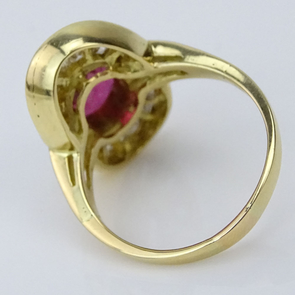 Oval Cut Ruby, Baguette, Square and Single Cut Diamond and 14 Karat Yellow Gold Ring.