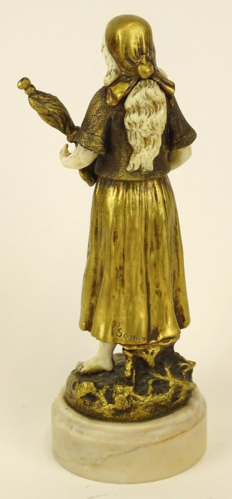 Theophile Francois Somme, French (1871-1952) Gilt bronze and ivory figure on marble base "Girl with Staff and Flag" 