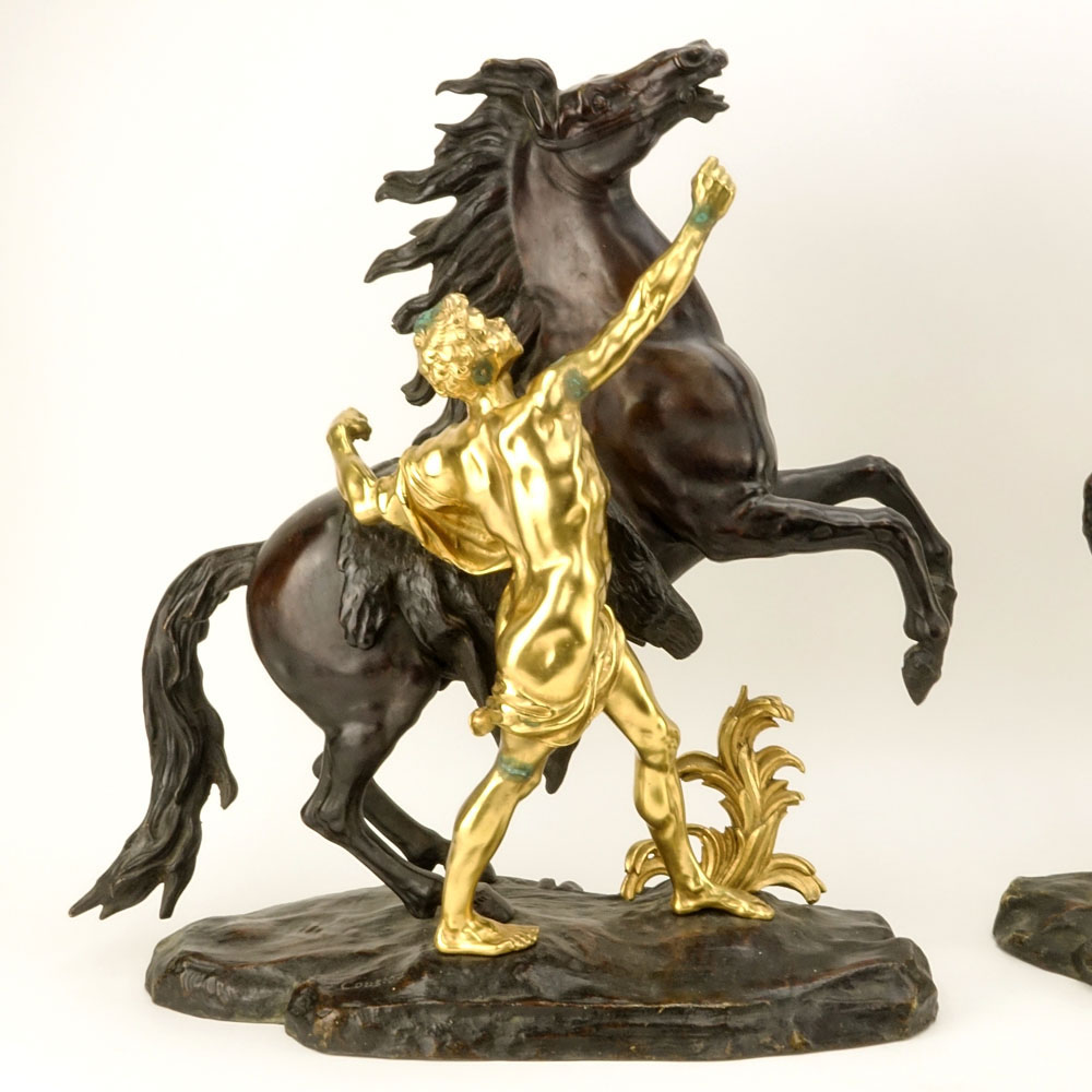 after: Guillaume Coustou the Younger, French (1716-1777) Pair of Patinated and Gilt Bronze Marly Horses. 