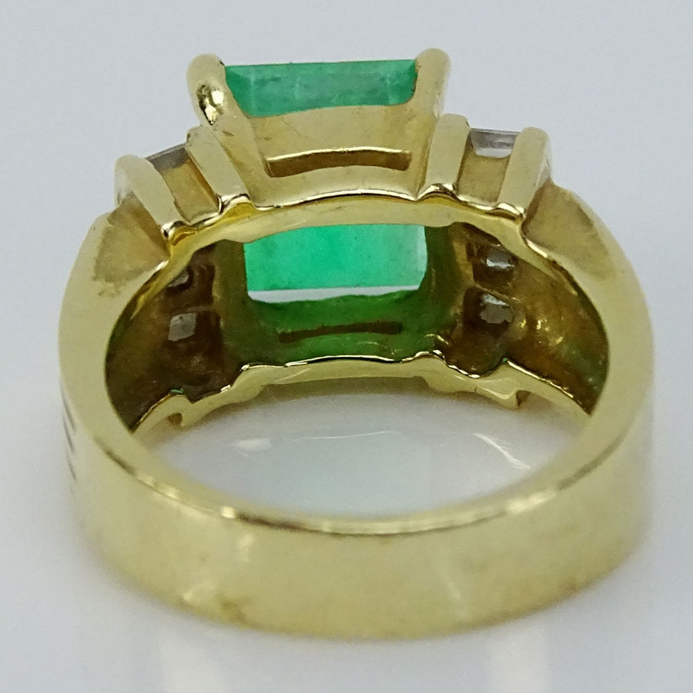 CGI Certified 4.24 Carat Square Step Cut Colombian Emerald, .42 Carat Baguette Cut Diamond and 14 Karat Yellow Gold Ring