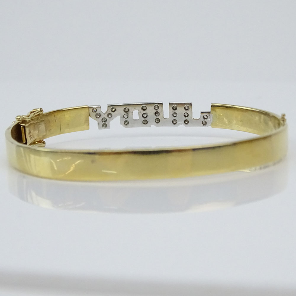 Vintage 14 Karat Yellow Gold Hinged Bangle Bracelet accented with Small Pave Set Diamonds Spelling "Judy". 
