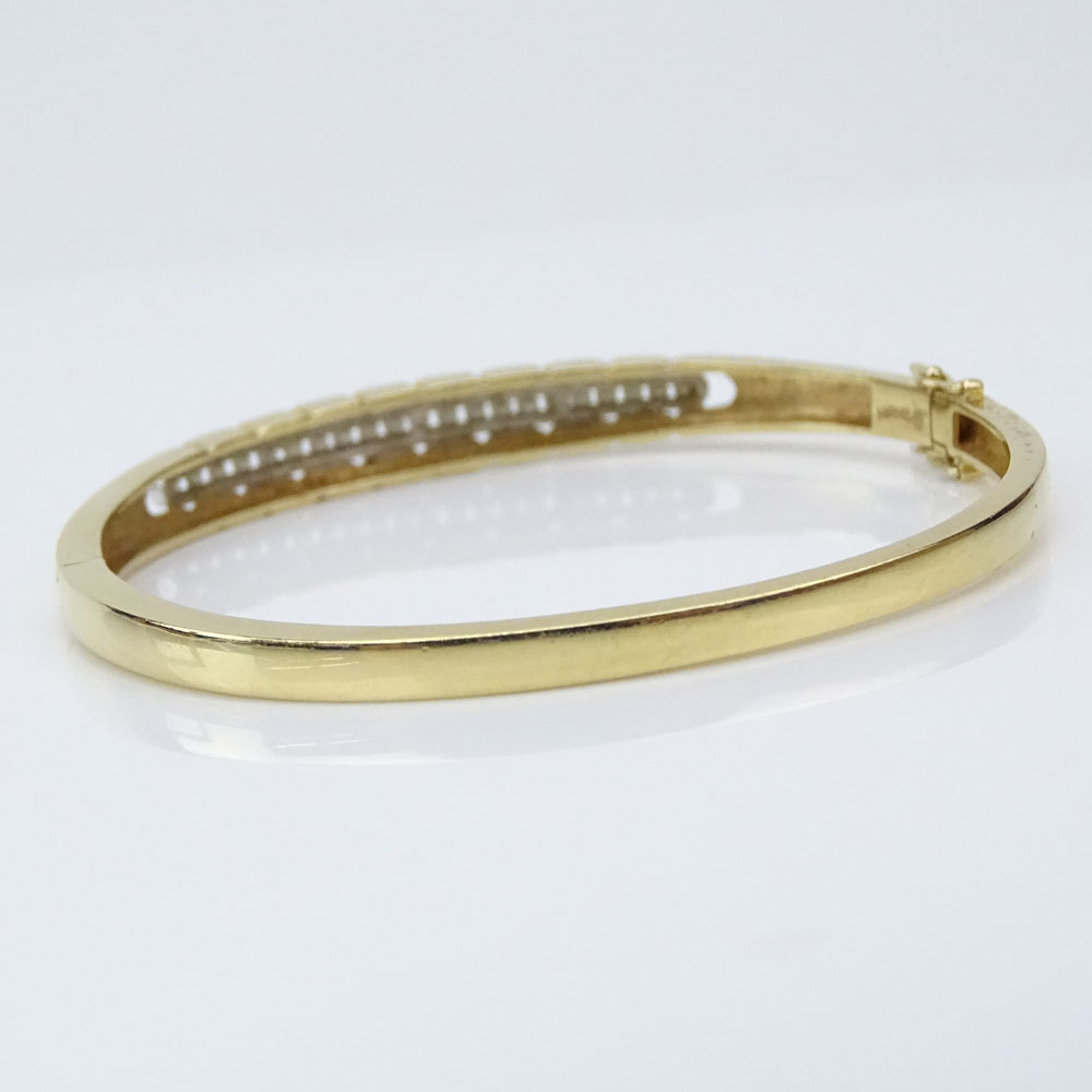 Lady's Vintage 14 Karat Yellow Gold Hinged Bangle Bracelet Accented with Small Round Cut Diamonds
