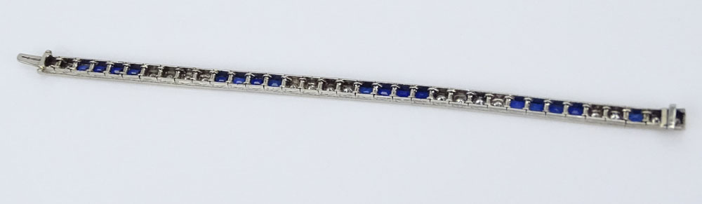 Art Deco French Cut Sapphire, Old European Cut Diamond and 18 Karat White Gold Bracelet. Sapphires with vivid saturation of color. 