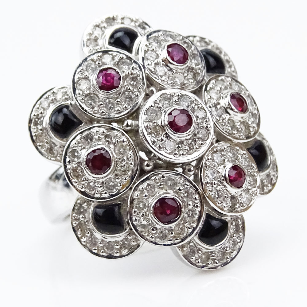 Lady's 18 Karat White Gold Ring Accented Throughout with Micro Pave Set Round Cut Diamonds and Round Cut Rubies