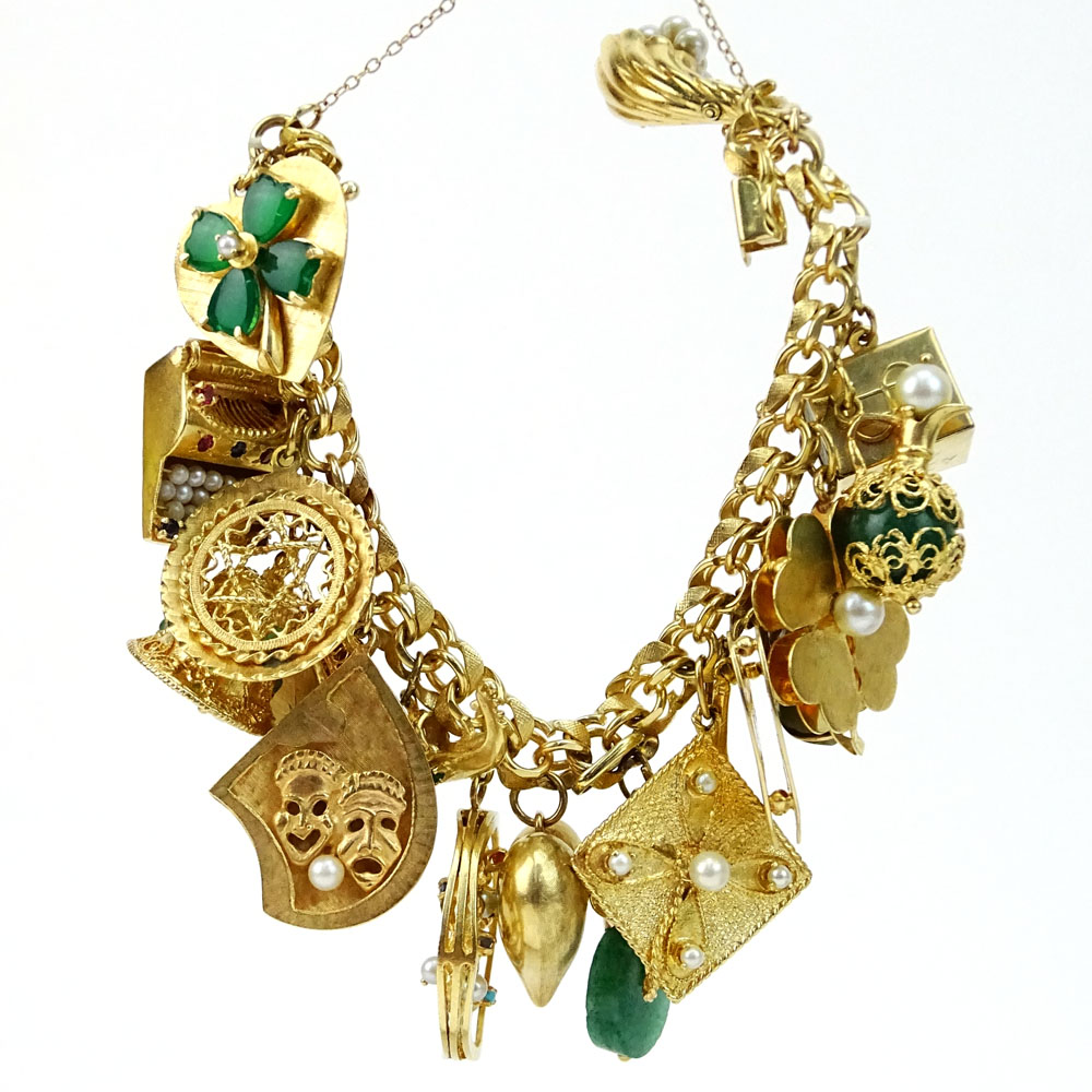 Vintage Heavy 14 Karat Yellow Gold Charm Bracelet with Nineteen (18) Assorted Interesting Charms