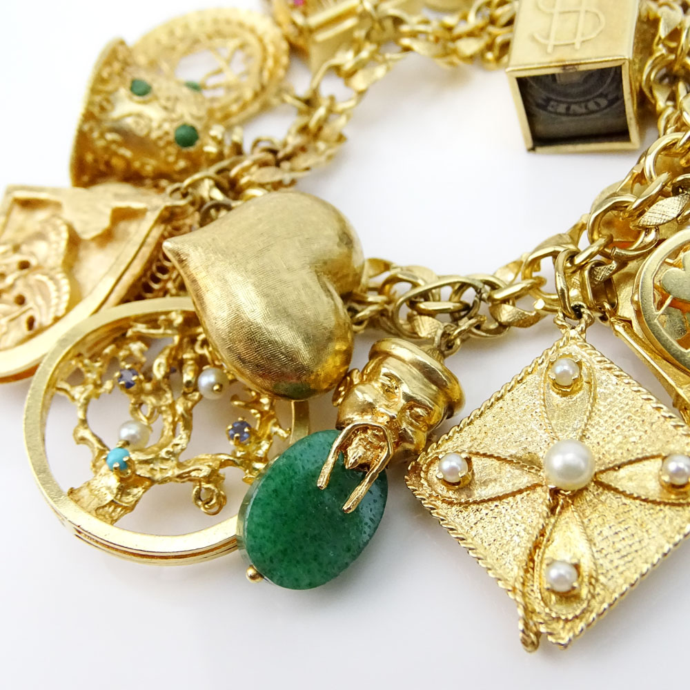 Vintage Heavy 14 Karat Yellow Gold Charm Bracelet with Nineteen (18) Assorted Interesting Charms