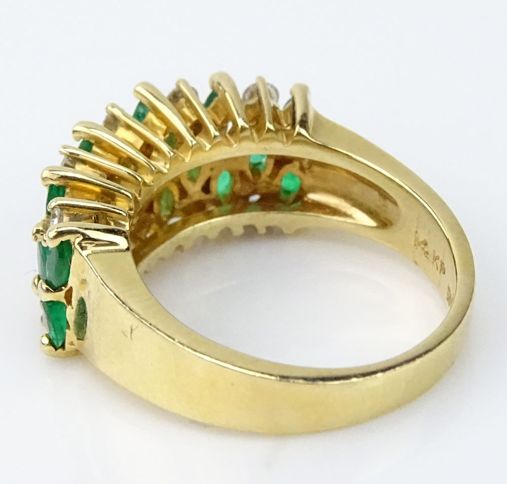 Vintage Oval Cut Emerald, Round Brilliant Cut Diamond and 14 Karat Yellow Gold Ring