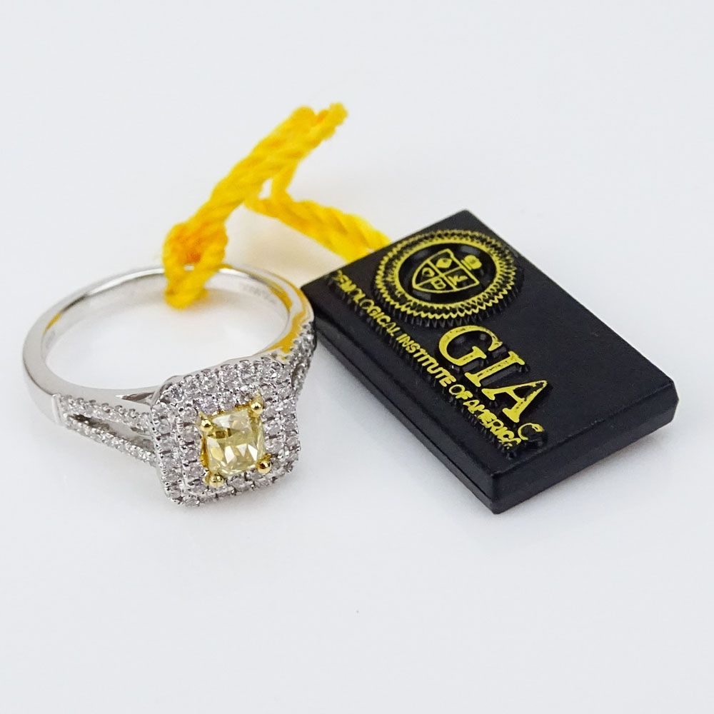 .50 Carat Cushion Cut Natural Fancy Yellow Diamond, .41 Carat Round Cut Diamond and 18 Karat White Gold Ring