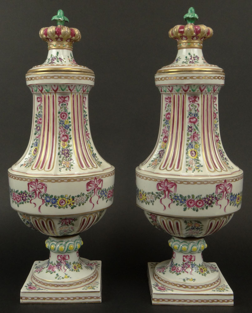 Pair of Early 20th Century French Louis XVI-style Painted Porcelain Urns with Crown Finials.