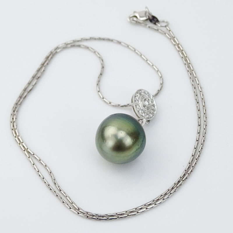 15mm South Sea Baroque Black Pearl and 14 Karat White Gold Pendant Necklace with Small Diamond Accents.