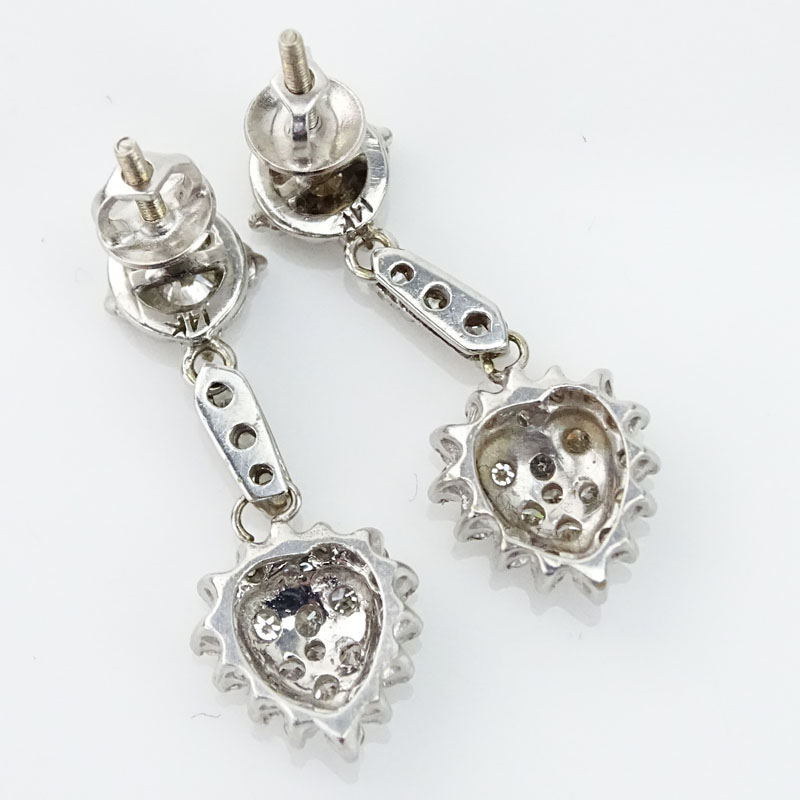 Vintage Round Brilliant Cut Diamond and 14 Karat White Gold Pendant Heart Earrings.
