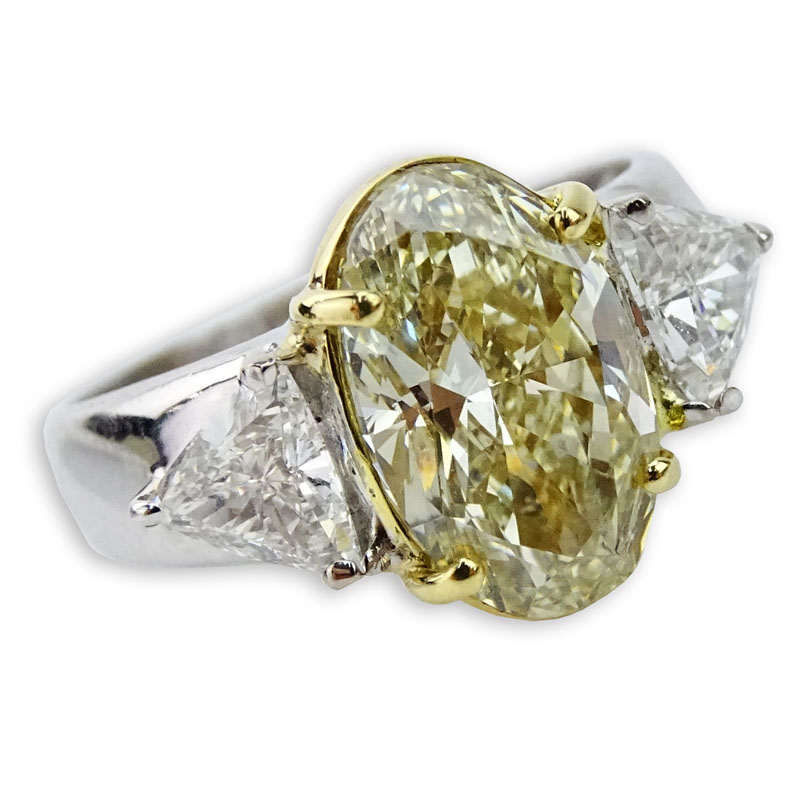 4.07 Carat Oval Cut Fancy Yellow Diamond and 18 Karat White Gold Engagement Ring