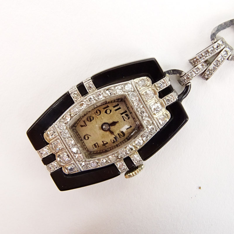 Art Deco Geneva, Swiss No. 3662 Circa 1925 18 Karat White Gold, Diamond and Onyx Lapel Watch.