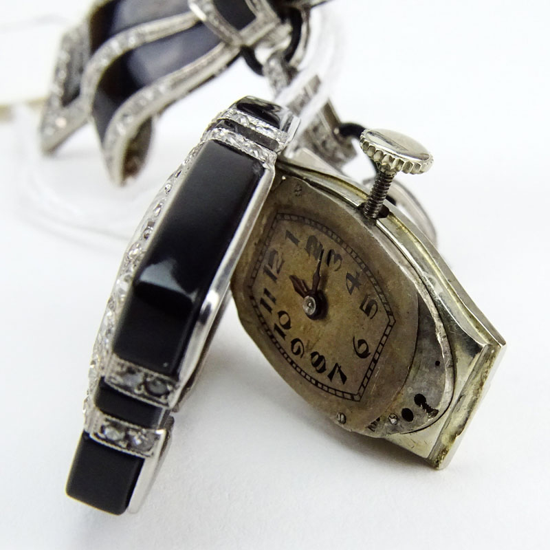 Art Deco Geneva, Swiss No. 3662 Circa 1925 18 Karat White Gold, Diamond and Onyx Lapel Watch.