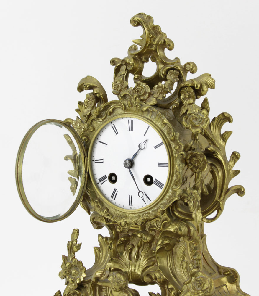 19/20th Century French Desorcy a Paris Rococo style Gilt Bronze Bracket Clock with Porcelain Dial and Figure of Pan to base