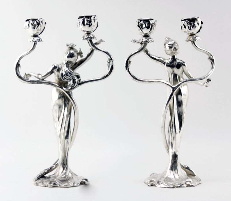 C. Bonnefond, French (19/20th Century) Pair of Art Nouveau Silvered metal figural candelabra.