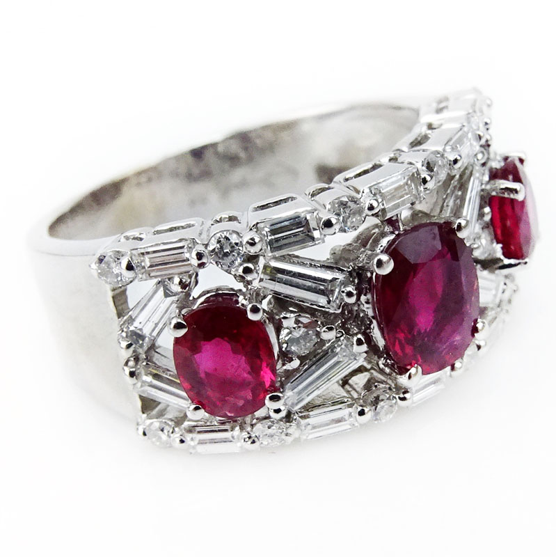 2.50 Carat Round Brilliant and Baguette Cut Diamond, Oval Cut Ruby and 18 Karat White Gold Ring.