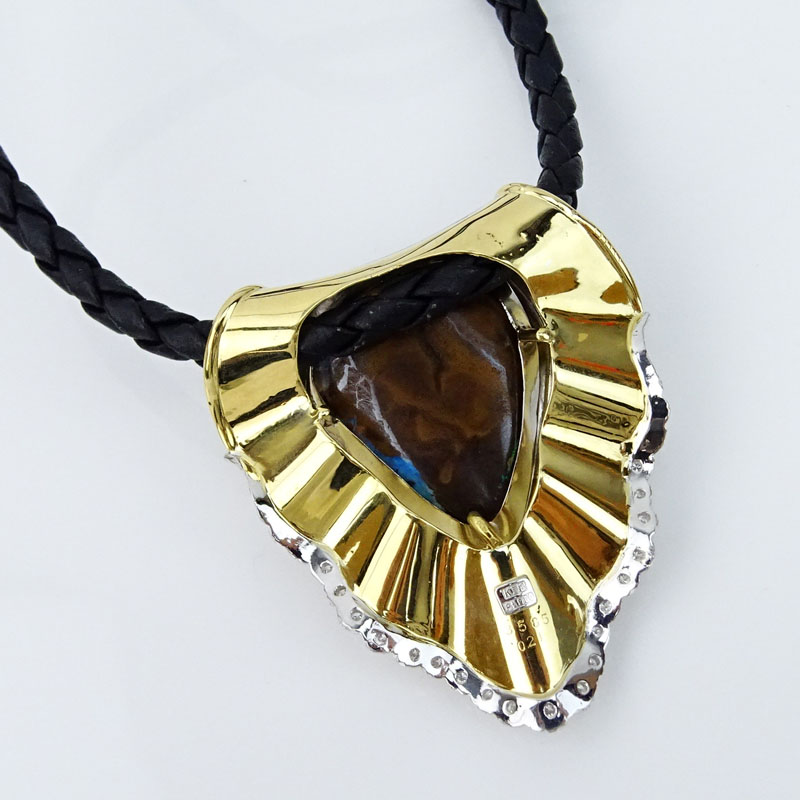 Large Black Opal, Platinum and 18 Karat Yellow Gold Pendant Necklace accented with Round Brilliant Cut Diamonds and suspended by Braided Leather Necklace