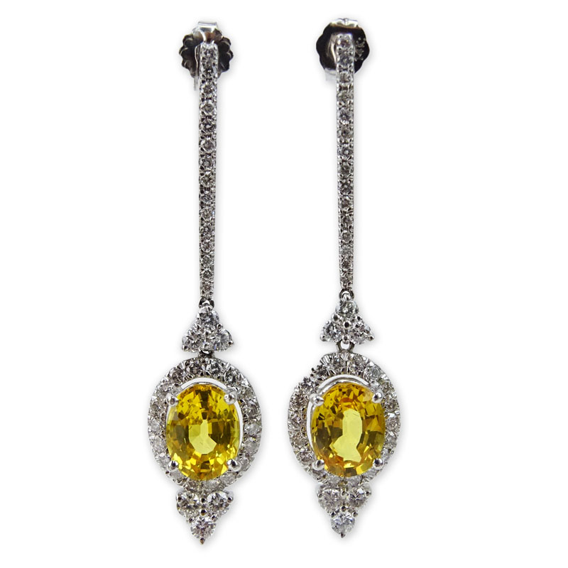 3.20 Carat Oval Cut Yellow Sapphire, 2.30 Carat Round Brilliant Cut Diamond and 14 Karat White Gold Dangle Earrings