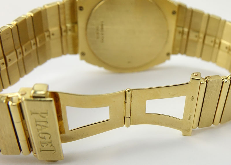 Man's Vintage Piaget Heavy 18 Karat Yellow Gold Bracelet Watch with Black Dial and Automatic Movement