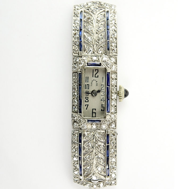 Circa 1920s Lady's Tiffany & Co Art Deco Single Cut Diamond, Platinum Filigree and Sapphire Watch with Manual Movement