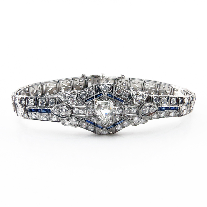 Art Deco Approx. 7.30 Carat TW Diamond, Sapphire and Platinum Belly Bracelet set in the center with a 1.0 carat Shield Shape Diamond 