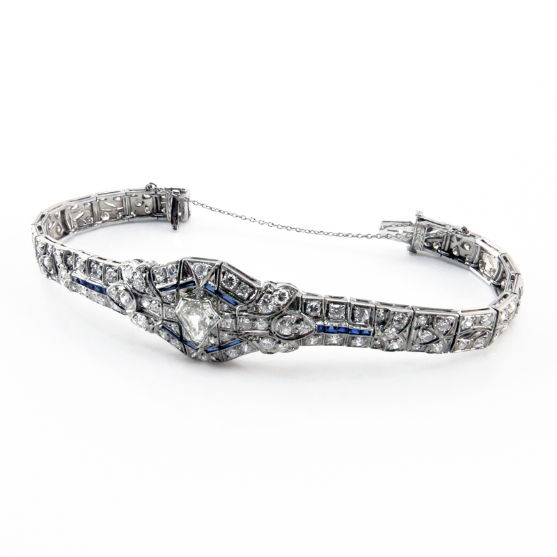 Art Deco Approx. 7.30 Carat TW Diamond, Sapphire and Platinum Belly Bracelet set in the center with a 1.0 carat Shield Shape Diamond 