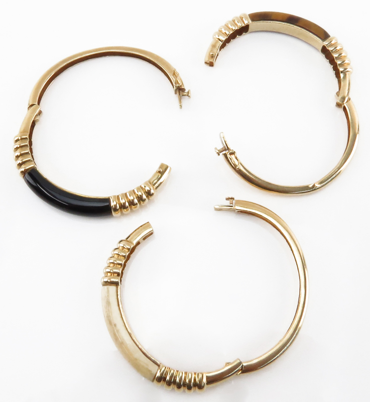 Set of Three Vintage 14 Karat Yellow Gold Bangle Bracelets set with Tiger-eye, Black Onyx and Ivory
