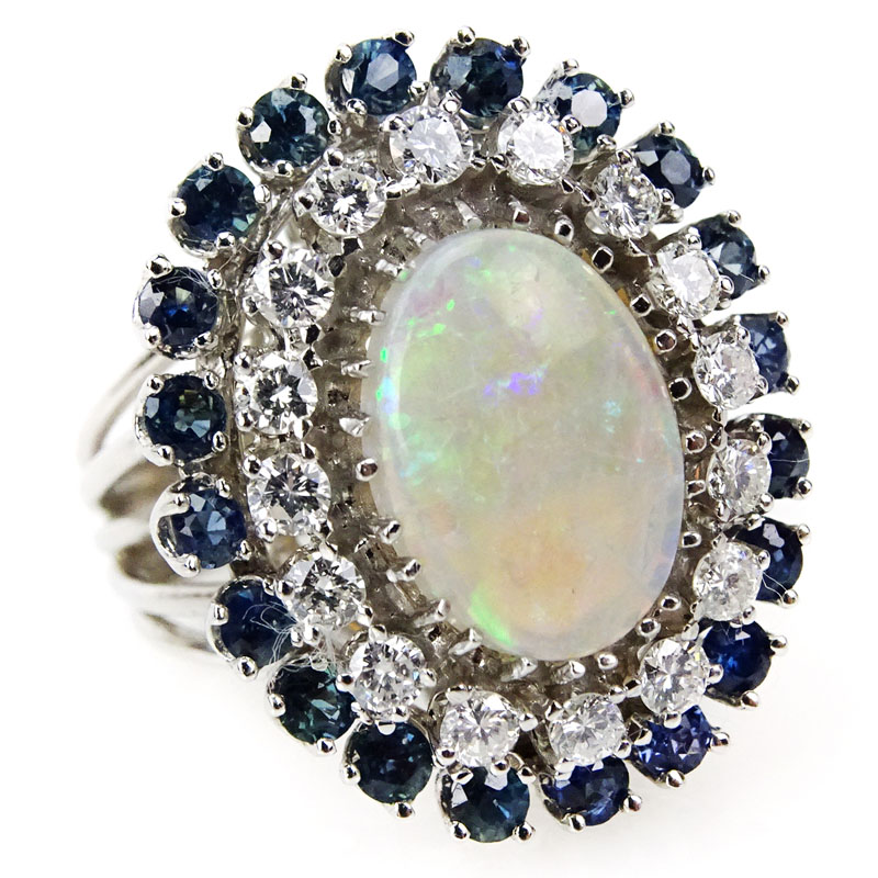 Vintage 1970s Australian Opal, 2.50 carat Round Brilliant Cut Diamond, Round Brilliant Cut Sapphire and 14 Karat White Gold Ring