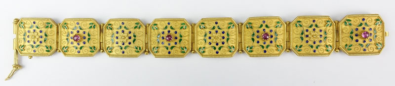 Rare Antique Byzantine style 18 Karat Yellow Gold Hinged Link Bracelet accented with Four Cabochon Rubies and Enamel