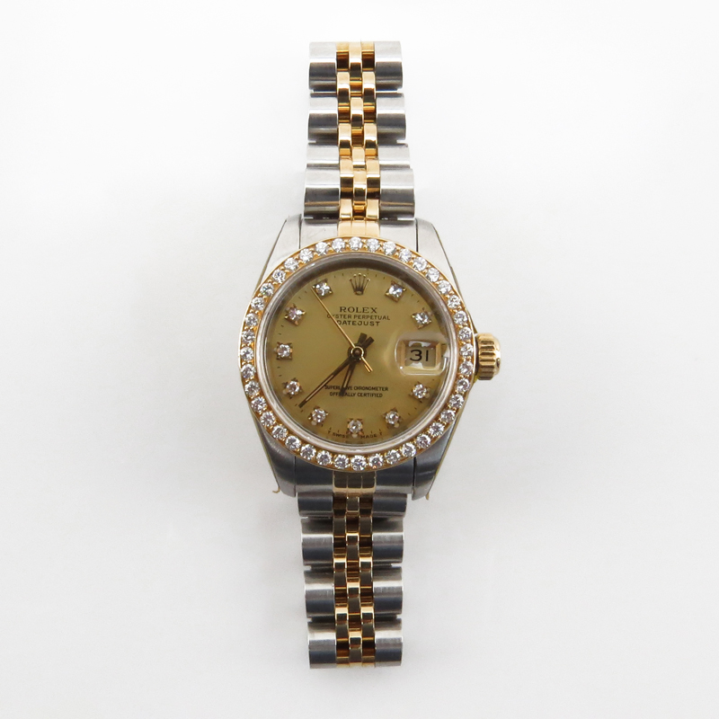 Lady's Rolex DateJust Two Tone Stainless Steel and 14 Karat Yellow Gold Automatic Movement Watch with Diamond Hour Markers and after market Diamond Bezel