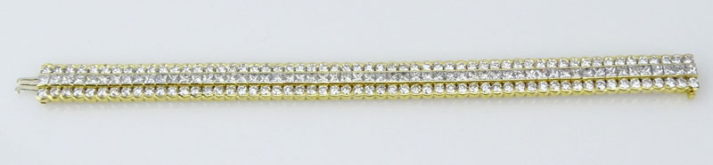 Approx. 25.0 Carat Bezel Set Round Brilliant Cut and Invisible Set Princess Cut Diamond and 18 Karat Yellow Gold Three Row Bracelet