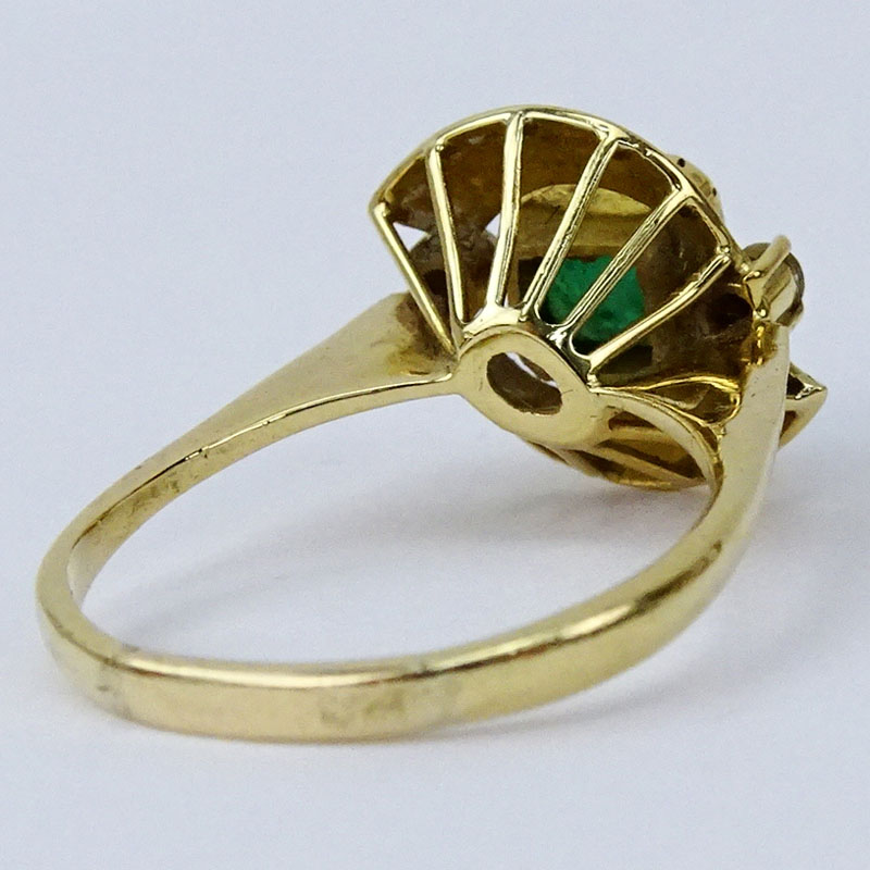 Vintage Colombian Emerald and 18 Karat Yellow Gold Ring Accented with two small Diamonds