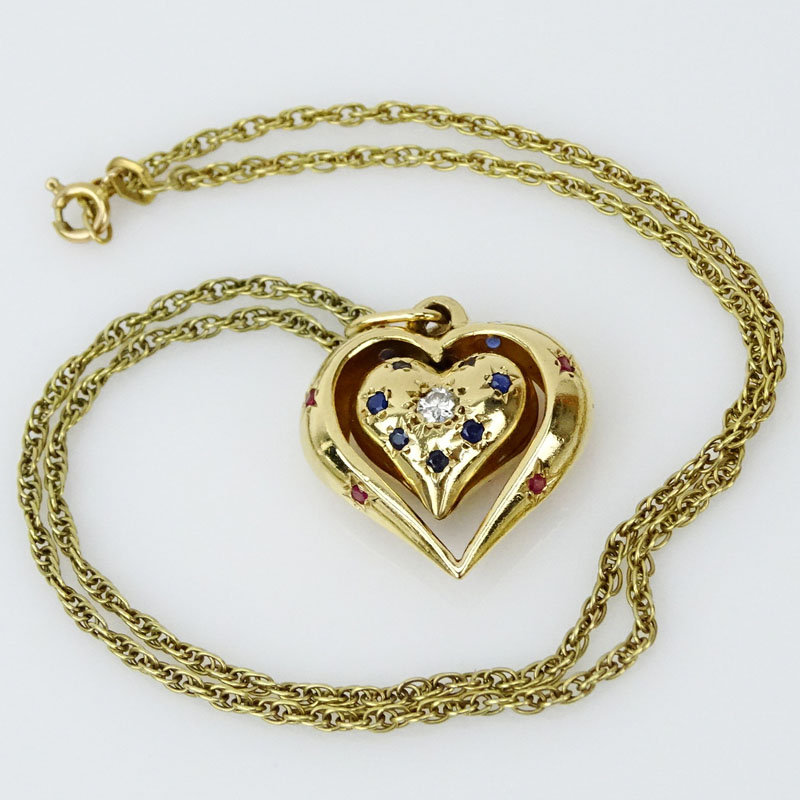 Vintage 14 Karat Yellow Gold Heart Pendant Necklace, the Heart Pendant accented with a Round Brilliant Cut Diamond, Rubies and Sapphires