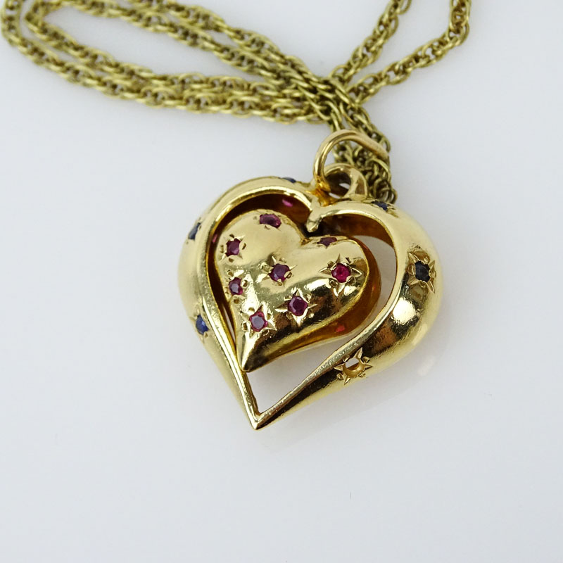 Vintage 14 Karat Yellow Gold Heart Pendant Necklace, the Heart Pendant accented with a Round Brilliant Cut Diamond, Rubies and Sapphires