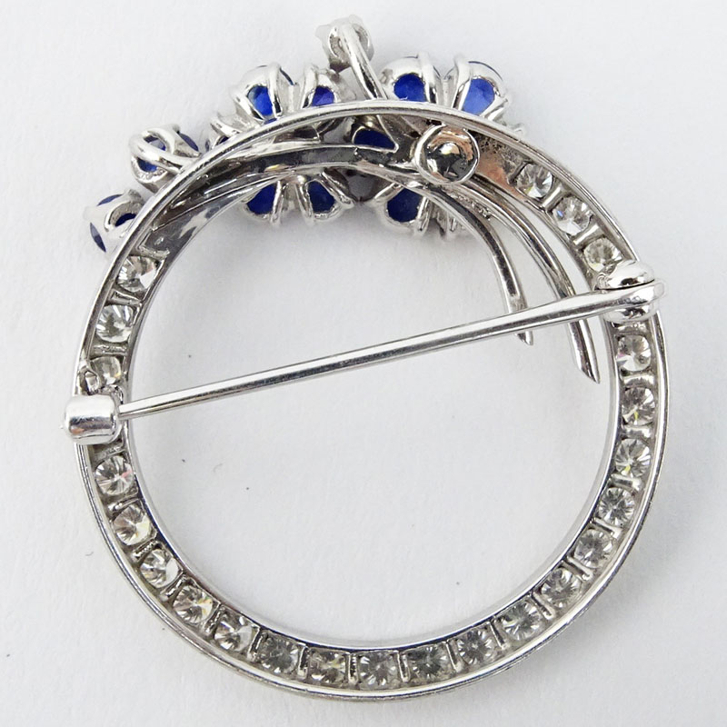 1940s Approx. .75 Carat Round Brilliant Cut Diamond, 1.50 Carat Sapphire and 18 Karat White Gold Circa Brooch
